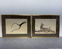 Wide view of two framed Native American ink and color drawings side by side showing bird and animal.