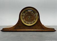 Full front view of the vintage Seth Thomas mantel clock showing wood case and clock face.