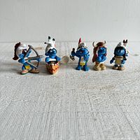 Full set of five vintage 2006 Schleich Smurf figurines displayed in a row.