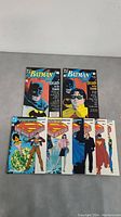 Overview photo showing 2 Batman 'A Death in the Family' comics and 6 Superman 'The Man of Steel' comics.