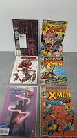 Six modern X-Men and Deadpool comics arranged in two columns
