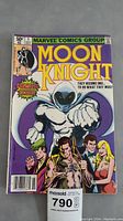 Front cover of Moon Knight Issue #1 comic book showing character and tape residue at top.