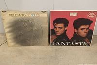 Front covers of Feliciano 10 To 23 album and Wham! Fantastic album side by side on a neutral gray surface.