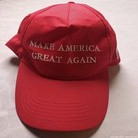 Front view of red 'Make America Great Again' hat with white embroidery.