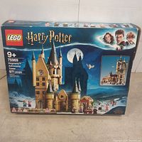 Box front image of Lego Harry Potter Hogwarts Astronomy Tower set 75969 showing the assembled tower and character minifigures