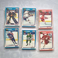 Six individual hockey cards wrapped in plastic, showing players Kirk McLean (Canucks), Pat LaFontaine (Islanders), Steve Yzerman (Red Wings), Mark Messier (Oilers), Barry Pederson (Whalers), and Doug Gilmour (Flames).