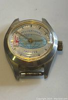 Front view of the International Traders watch face showing the dial design and hands.