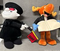 Bullwinkle and Boris plush dolls both standing side by side, dressed in costume with accessories.