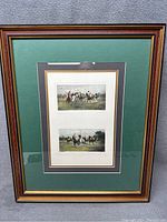 Two framed prints by George Wright depicting polo matches, matted and framed in wood.