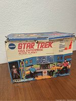 Original MEGO Star Trek USS Enterprise action playset box front showing playset image and branding.