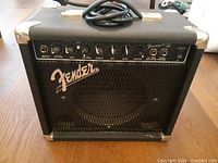Front view of the Fender Frontman Reverb amplifier showing control panel and Fender logo on metal grille.
