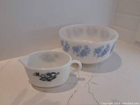 Federal bowl and Pyrex gravy boat displayed on countertop showing shape and size difference