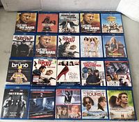 Photo of 20 DVD movies arranged in 4 rows of 5 cases each, displaying titles and cover arts.