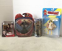 Front view of all 4 action figures arranged in a row, showing packaging and figure details