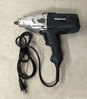Mastercraft electric impact wrench showing overall front and side view including metal head and power cord.