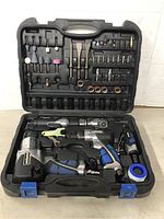 Open carrying case showing full kit including air tools and various accessory bits and sockets.