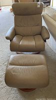 Front view of recliner and ottoman showing overall condition