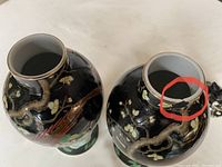 Top view showing one jar's mouth edge with small damage (chip) and detailed view of the black glaze around the rim.