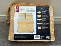 Photo showing the packed 7 piece double bed duvet cover set in yellow pattern with brand Mainstays and bed-in-a-bag label.