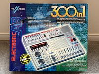 Front view of Nexxtech Electronic Lab box showing 300-in-1 project capability and colorful branding.