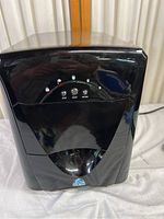 Front view of Polar electronic ice cube maker showing control panel and brand logo.