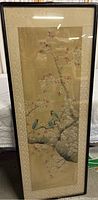 Full view of framed silk painting showing birds on a cherry blossom tree branch with decorative border.