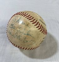 Signed baseball showing Willie McCovey's inscription and signature.