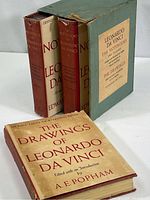 Three books and slipcase displayed together