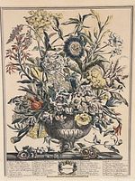 Close-up of the colored botanical floral arrangement showing detailed flowers and labeling beneath the image with the word 'September' in the center decorative frame.