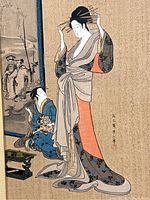 Close-up of the print showing a standing and seated woman in traditional kimonos and the artist's signature in Japanese characters.