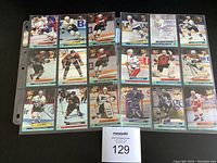 First photo showing one full 9x2 grid sheet of hockey cards with players in different uniforms
