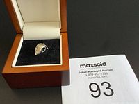 Full view of Pandora mouse charm inside a jewelry box with auction number card visible