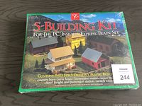 Front of boxed 5-building kit for PC Insiders Express Train Set. Box shows scale model buildings and product title.