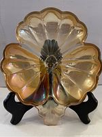 Front view of the carnival glass divided mint dish showing the iridescent finish and scalloped edges.