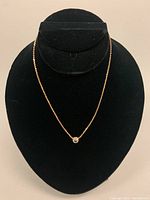 10K gold choker displayed on black velvet stand showing length and pendant