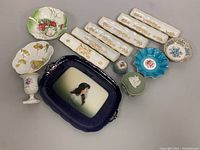 Photo of all items in the lot, including Rosenthal tray, porcelain dishes, trinket boxes, and bowl