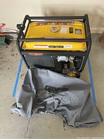 Front-angle view of generator with cover draped in front