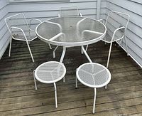 Full set overview: 3 chairs, round table, 2 side tables on deck