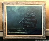 Full view of the framed oil painting depicting three-masted sailing ship at sea