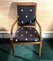 Front view of the chair showing frame, seat cushion, backrest and upholstery pattern