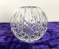 Front view showing globe shape and deep incised Waterford Lismore pattern on clear crystal.
