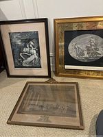 Four antique framed prints arranged showing wood and gilded frames, includes Rembrandt Youth With a Black Cap and others.