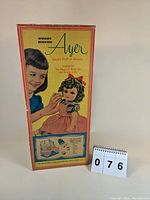 Full front view of the box showing the main artwork and text about the doll.
