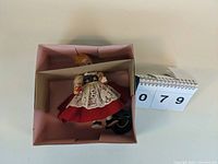 Madame Alexander Poland doll, 7-inch, in original pink box with accessories.