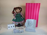Marie Osmond Adora Belle Holiday 2002 doll with certificate, candy cane accessory, and pink striped box.