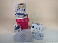Marie Osmond Beary Best Friends Tiny Tot doll sitting on the original branded box with certificate and small plush teddy bear also included.