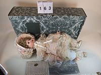 Vincent DeFilippo designed DeeDee porcelain doll displayed in original green marbled box