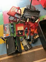 Overview of all automotive tools and accessories laid out on colorful foam puzzle mat.