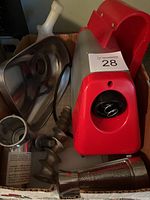 Red and silver electric base and assorted attachments in box