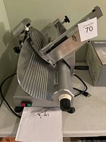 Side view of stainless steel slicer on countertop